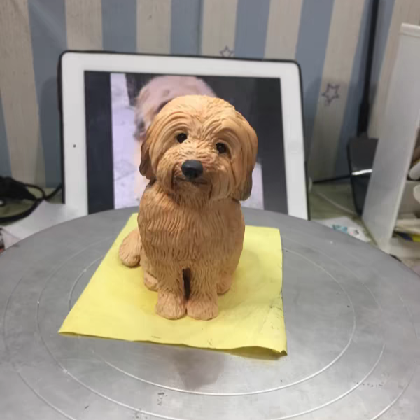 A cute realistic shaggy dog soft ceramic sculpture