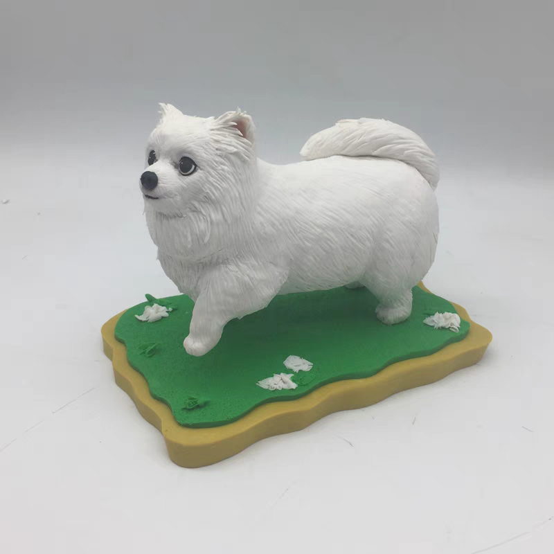 A cute white dog sculpture in soft ceramic.