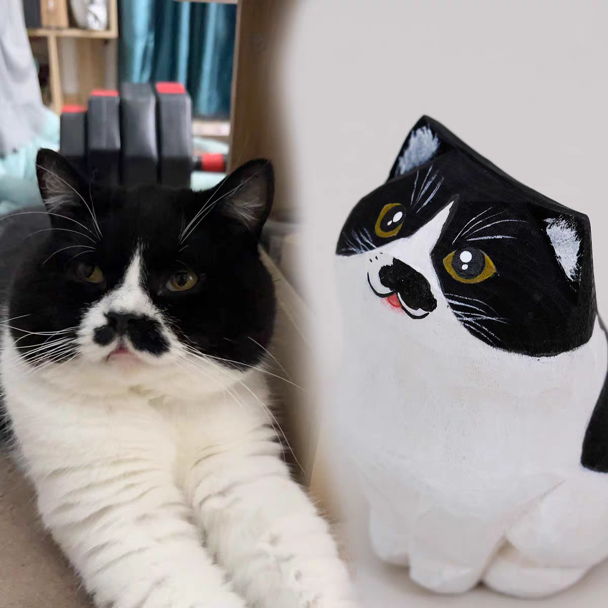A fluffy, cute cat with a little wooden statue exactly like her next to it