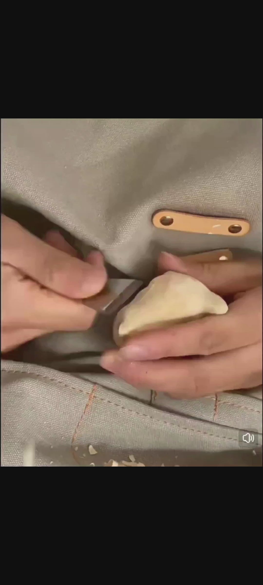 A man carving a wooden kitten, from the carving to the coloring, the finished product is lifelike