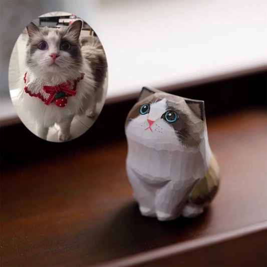 A fluffy, cute cat with a little wooden statue exactly like her next to it